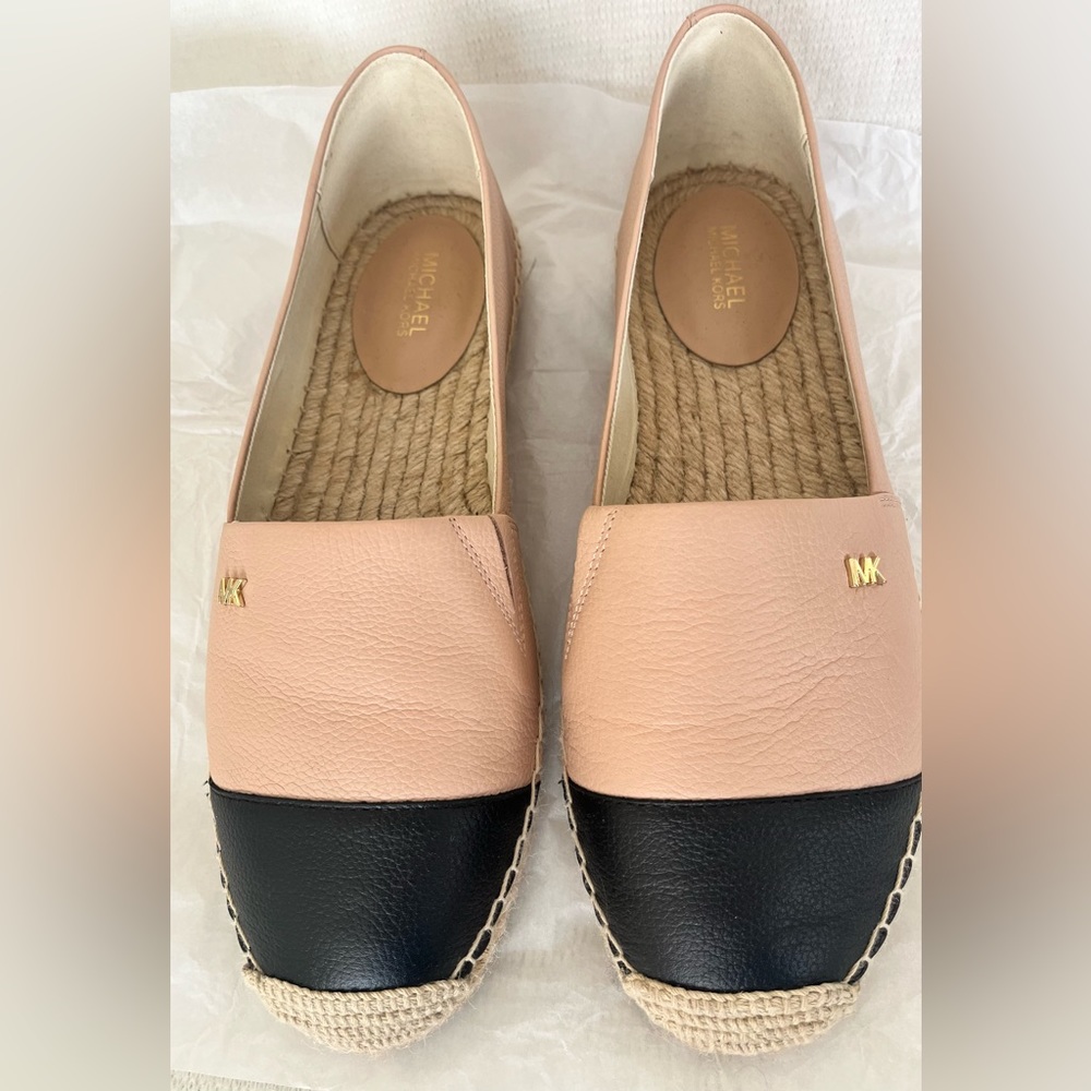 Michael Kors slip on. Size 9. Color. Oyster/Black Leather. Brand new. No box.